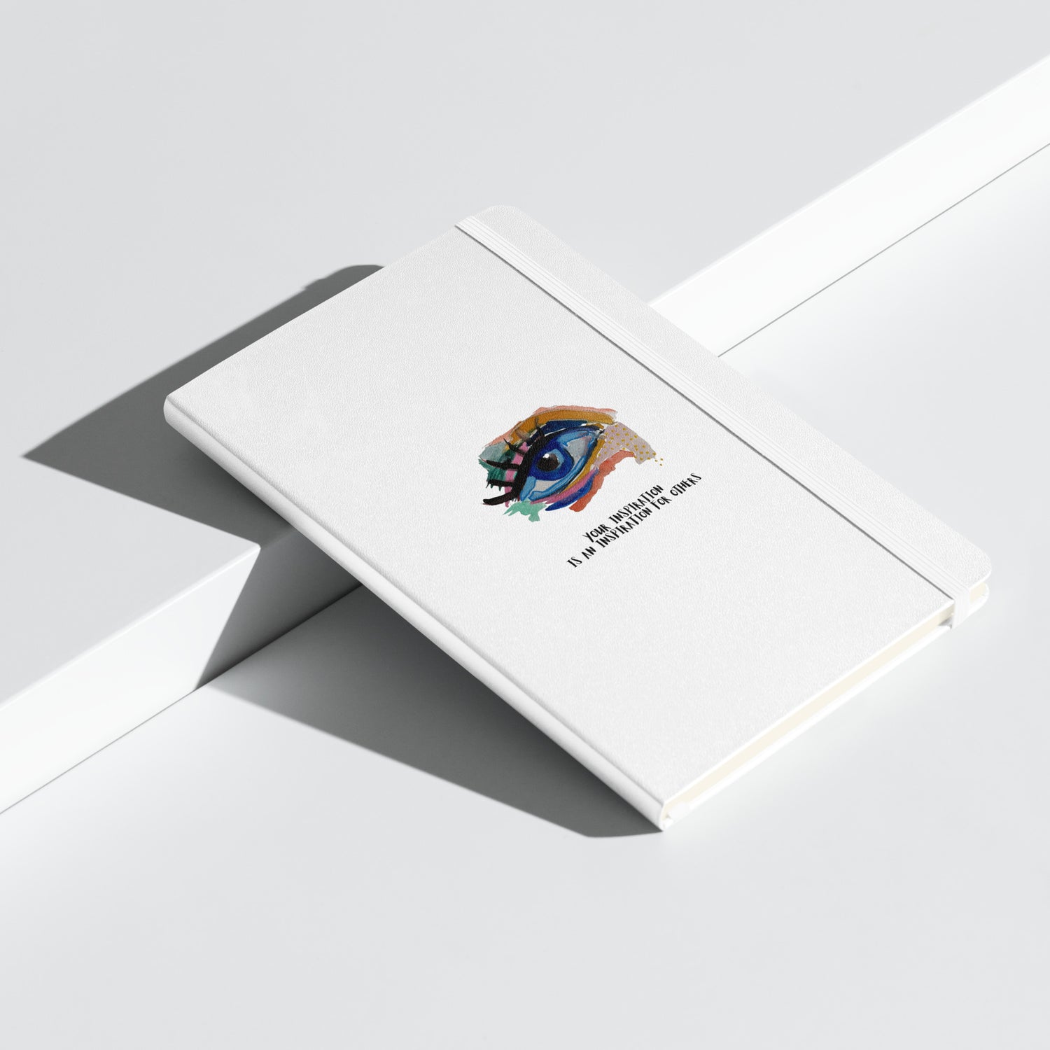hardcore bound white notebook with a print of a colorful eye